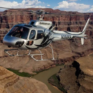 Helicopter soaring over the Colorado at West Rim